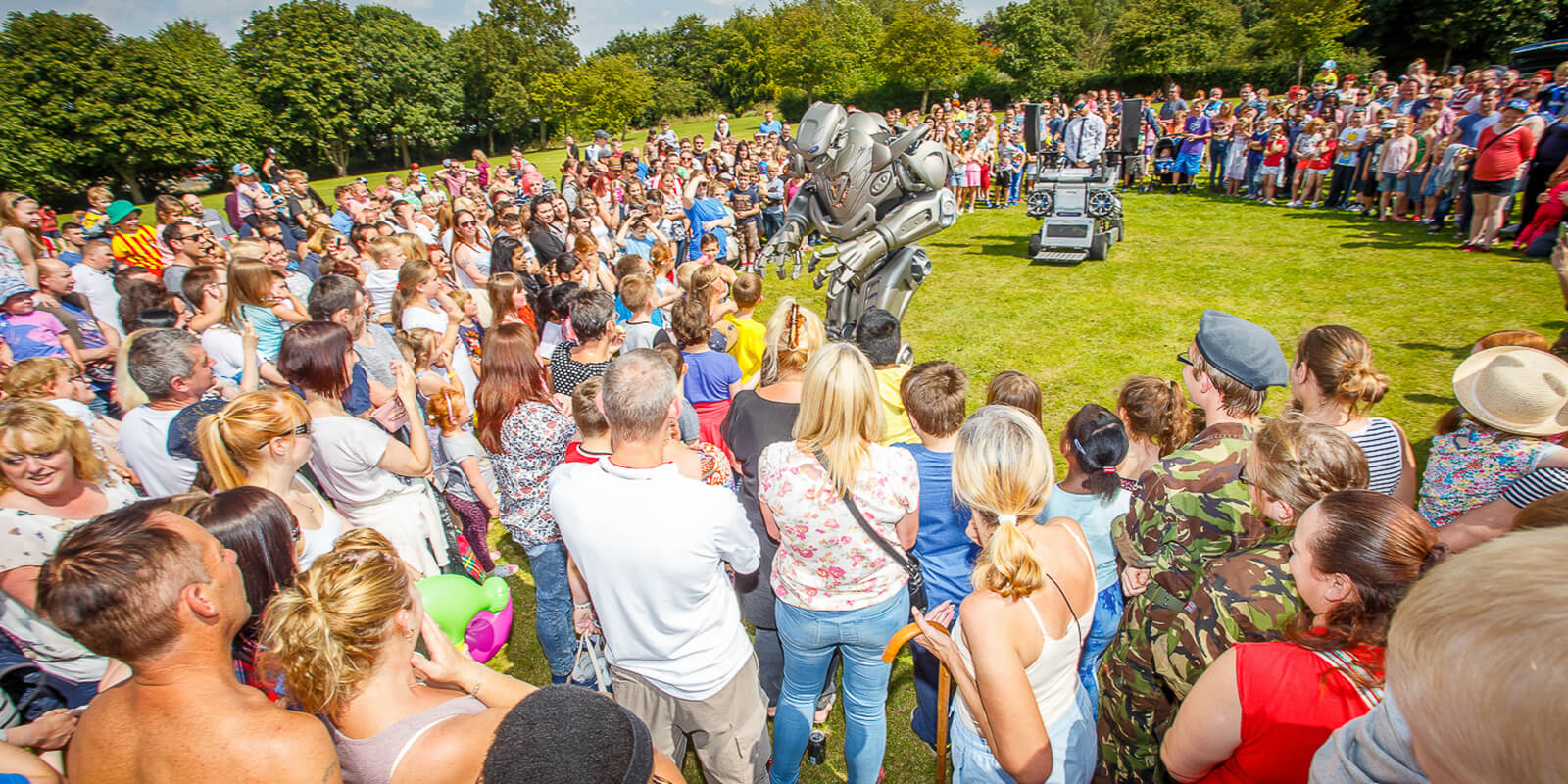group of people around a robot